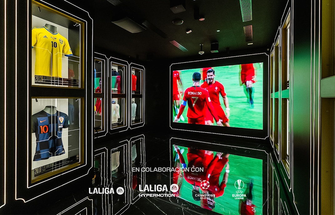 Football memorabilia display at Legends: The Home of Football Museum, featuring iconic jerseys and trophies.