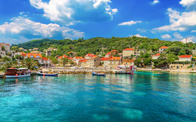 Sipan Island harbor with boats and stone houses, Elaphiti Islands, Dubrovnik, Croatia.