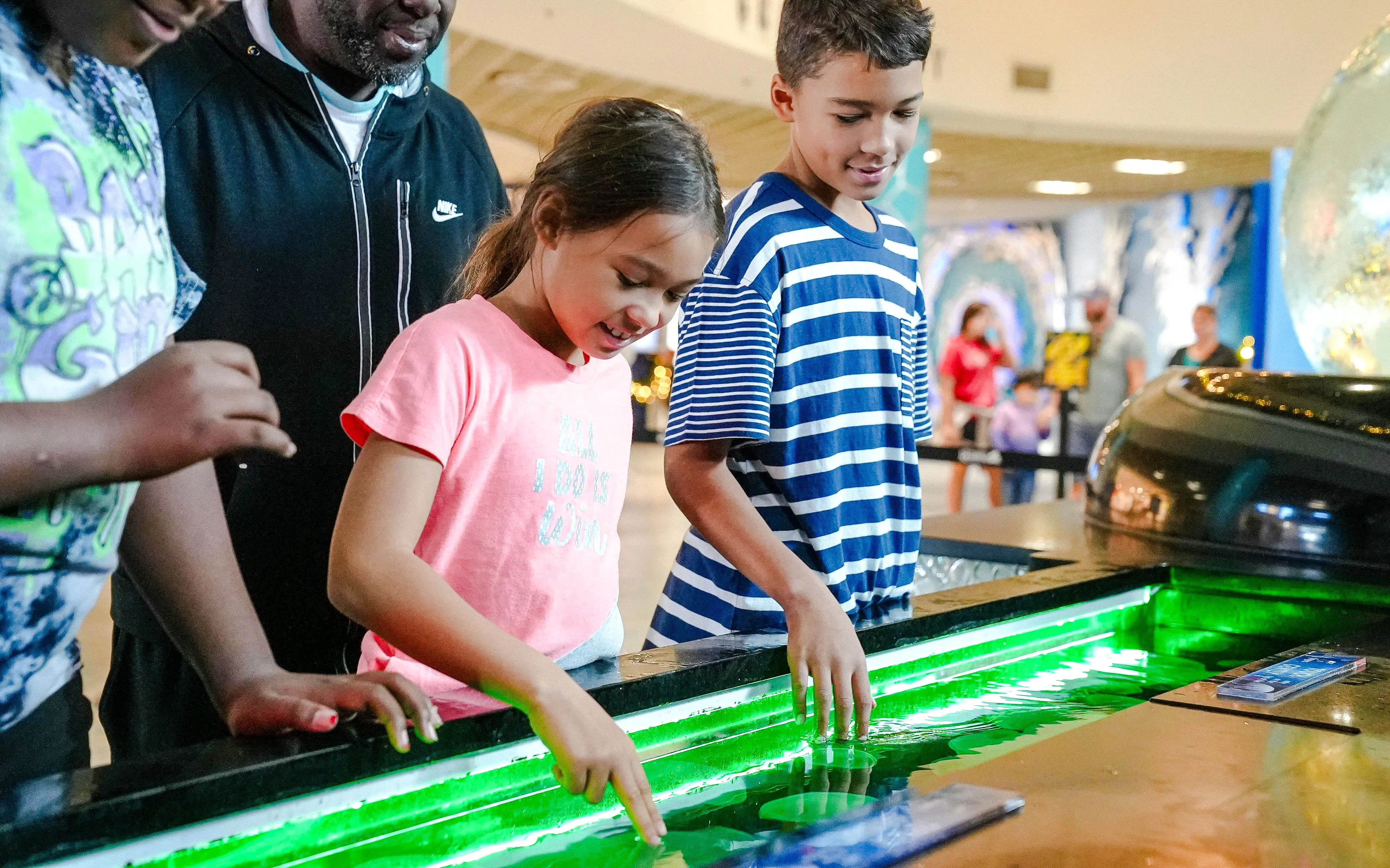 Children interacting with touch tank at The Florida Aquarium, Tampa.
