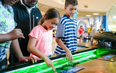 Children interacting with touch tank at The Florida Aquarium, Tampa.