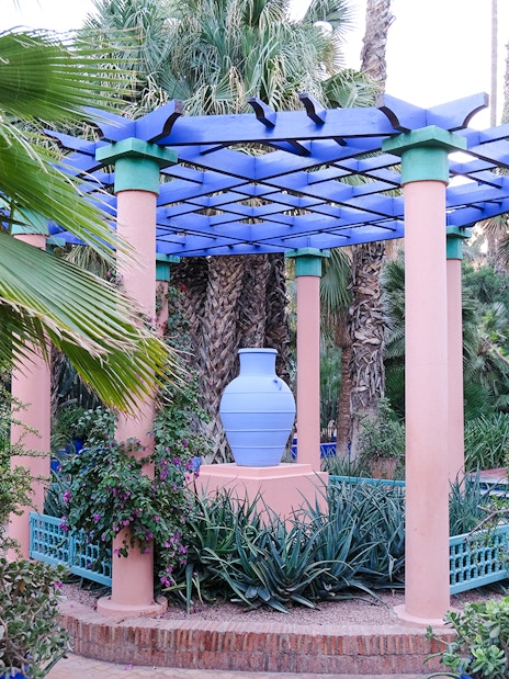 Jardin Majorelle garden with blue pergola and lush greenery in Marrakech.