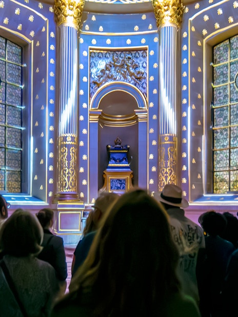 Visitors experiencing Aura Immersive light show at Invalides, Paris.