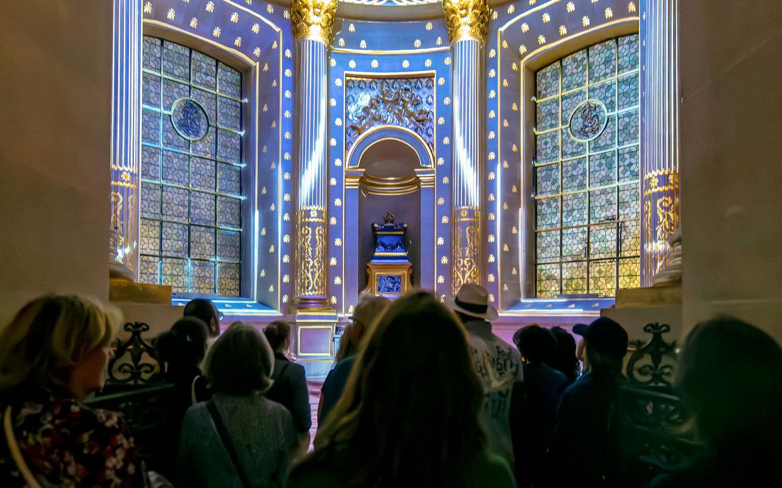 Visitors experiencing Aura Immersive light show at Invalides, Paris.