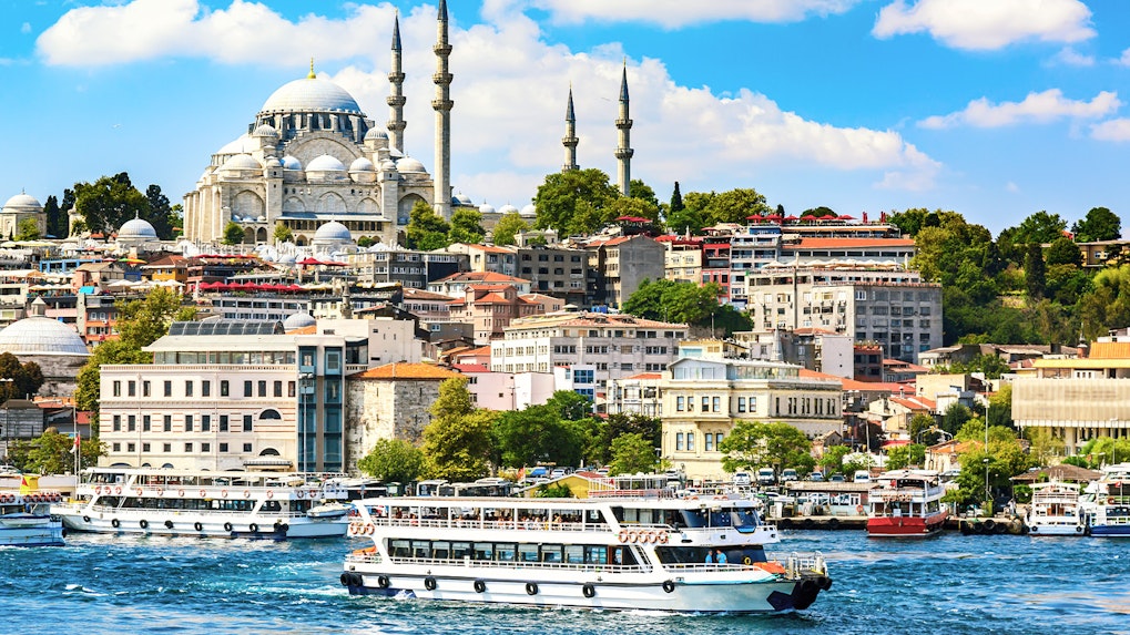 Bosphorus Strait cruise with view of Istanbul skyline and mosque.