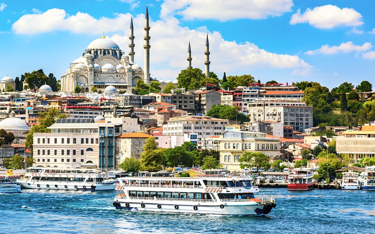 Bosphorus Strait cruise with view of Istanbul skyline and mosque.