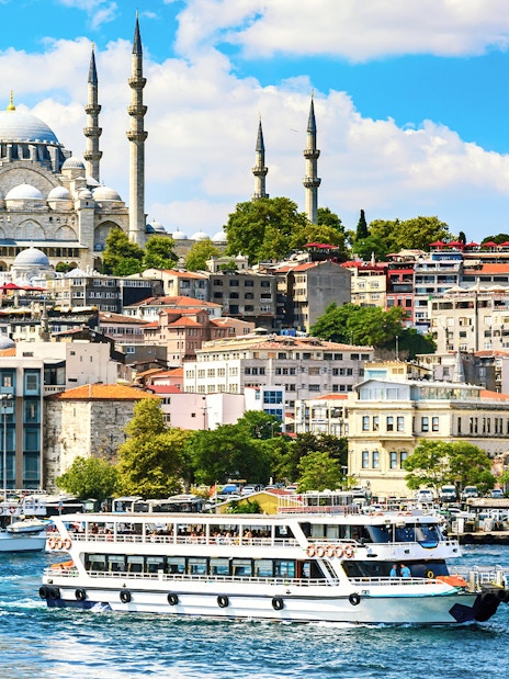 Bosphorus Strait cruise with view of Istanbul skyline and mosque.