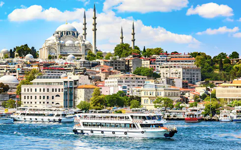 Bosphorus Strait cruise with view of Istanbul skyline and mosque.