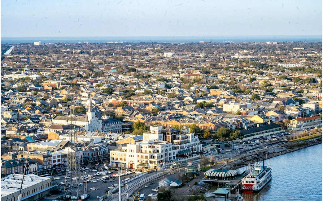 Aerial view of New Orleans from Vue Orleans Observation Deck, featuring the Mississippi River and cityscape.