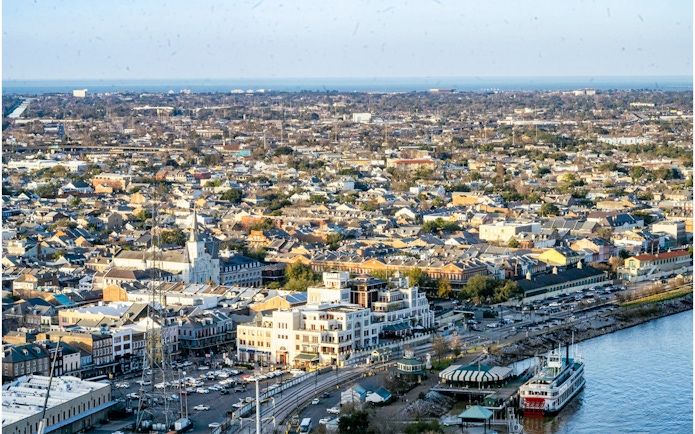 Aerial view of New Orleans from Vue Orleans Observation Deck, featuring the Mississippi River and cityscape.