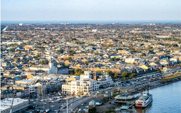Aerial view of New Orleans from Vue Orleans Observation Deck, featuring the Mississippi River and cityscape.