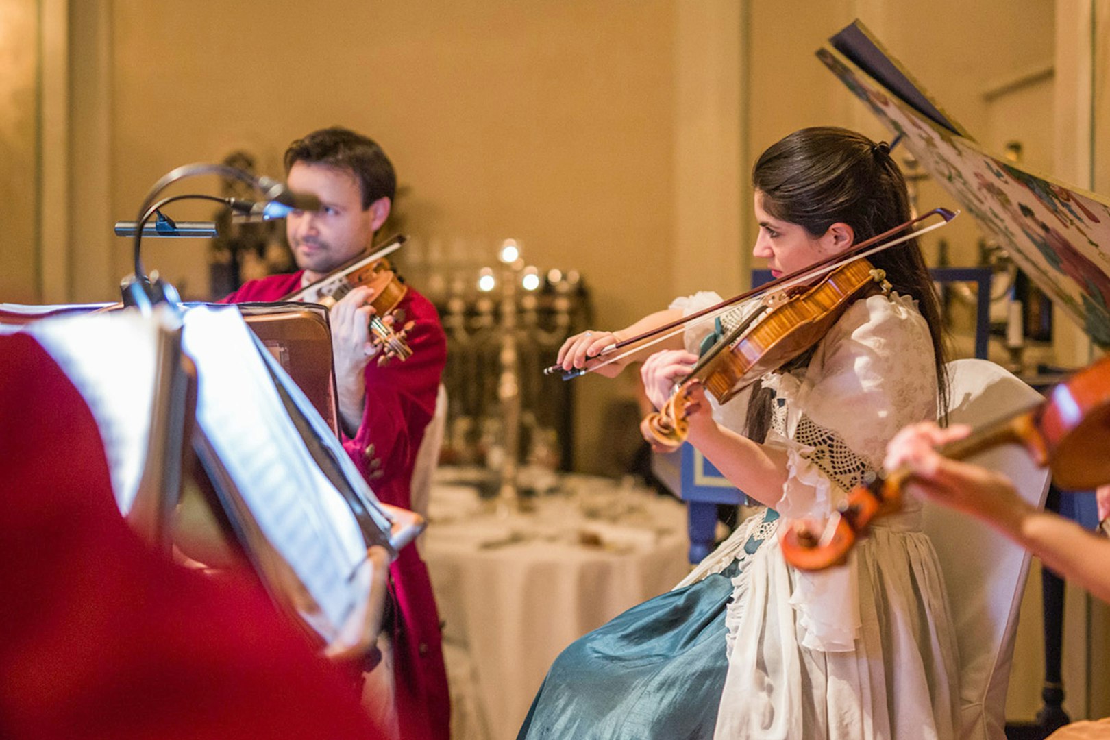 Musicians in period costumes performing at a Mozart concert in Salzburg.