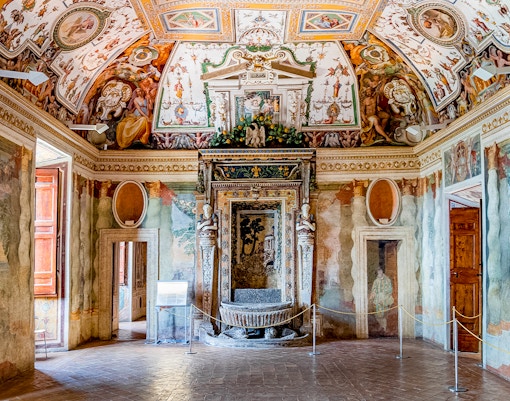 Villa d’Este interior with ornate frescoes and detailed ceiling in Tivoli, Italy.
