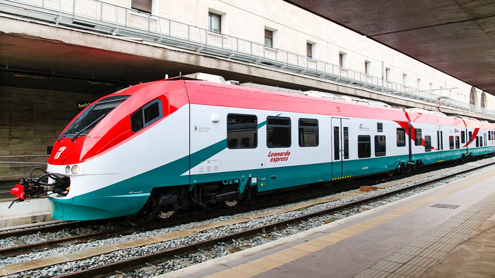 Leonardo Express train at Rome's Termini Station platform, connecting to Fiumicino Airport.