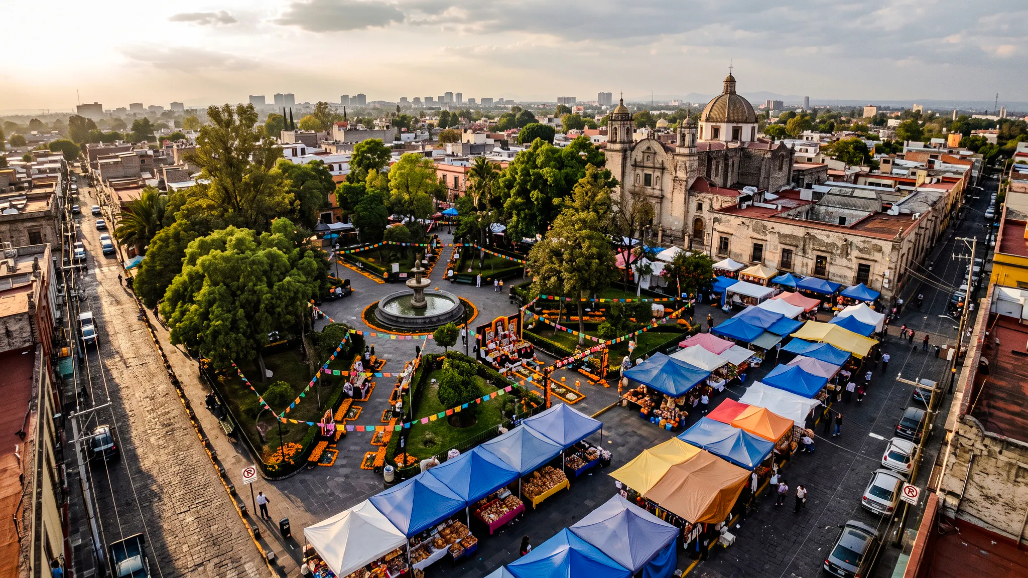 Plaza with colorful market stalls and Day of the Dead decorations, Mexico City.
