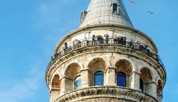 Visitors on the observation deck of Galata Tower, overlooking Istanbul, Turkey.