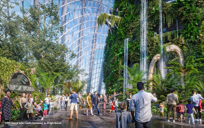 Visitors at Gardens by the Bay exploring the Jurassic World exhibit with dinosaur sculptures.