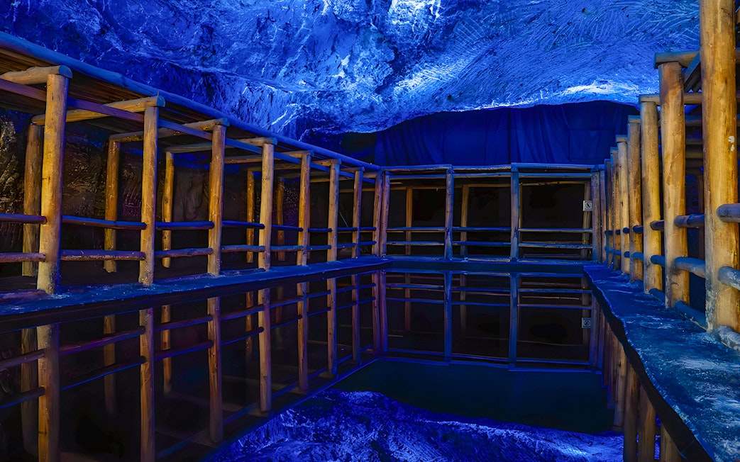 Water mirror reflecting wooden structures in Salt Cathedral of Zipaquirá, Colombia.