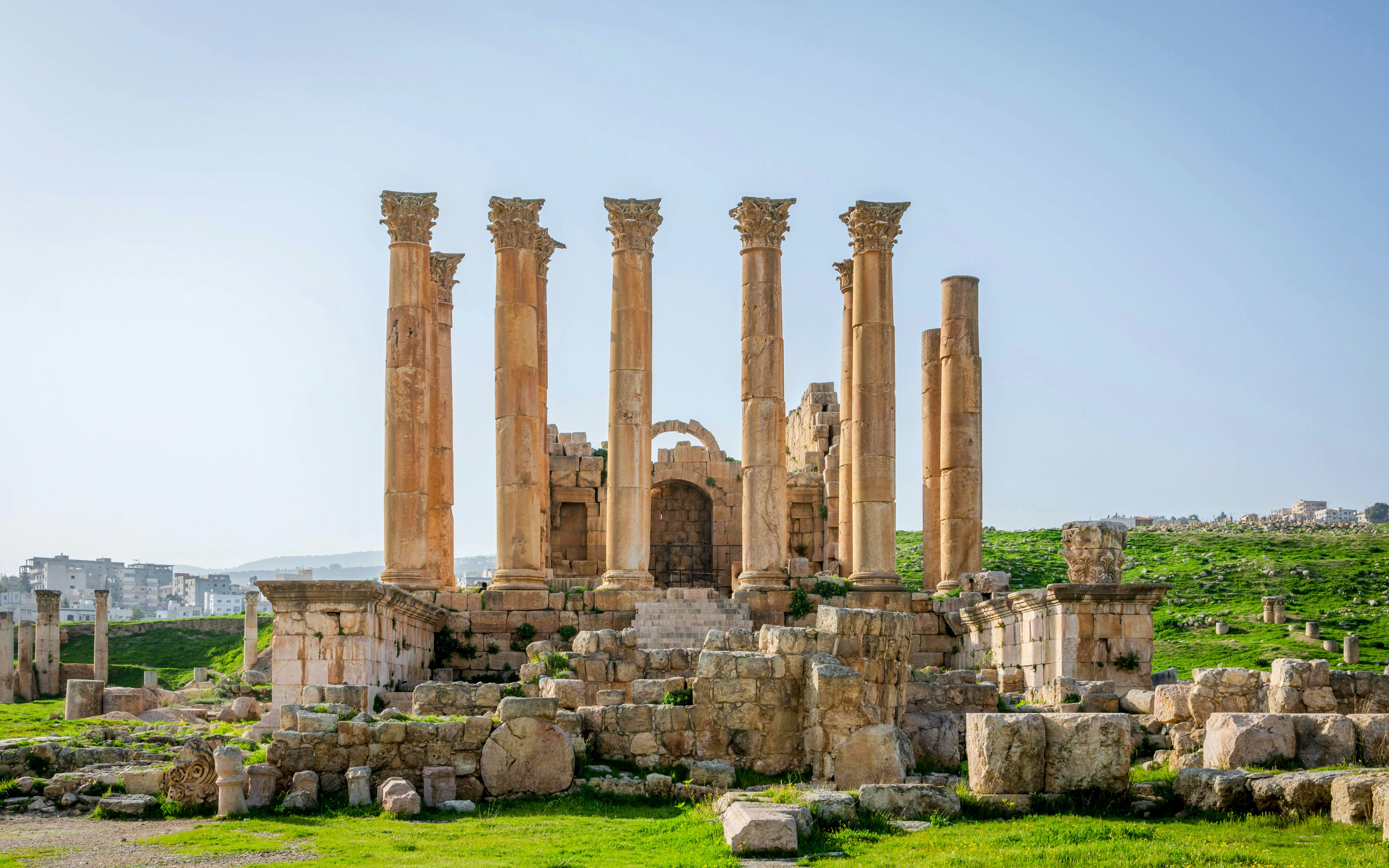 Temple of Artemis ruins at Roman site of Gerasa, Jerash, with surrounding landscape.
