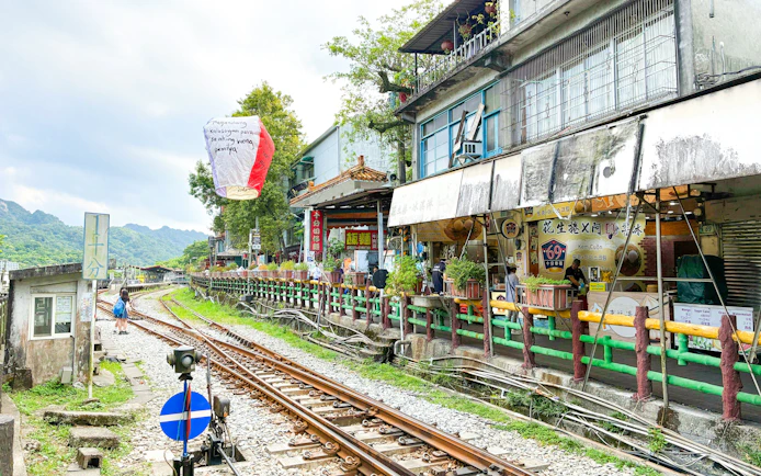 Shifen Station with sky lanterns and shops along Pingxi Branch Railway, New Taipei City, Taiwan.