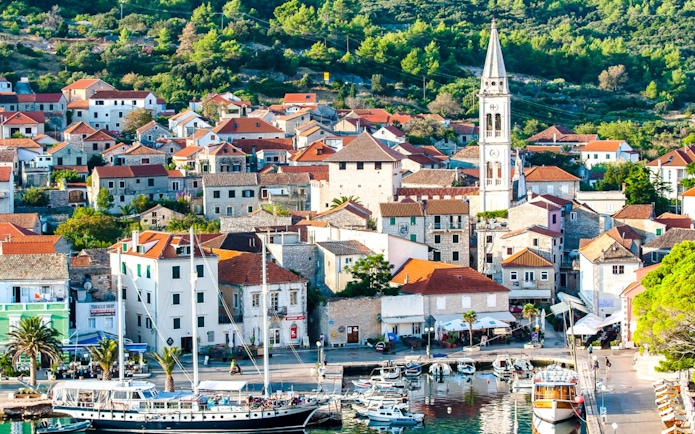 Old town of Jelsa with harbor and church tower, Hvar Island, Croatia.