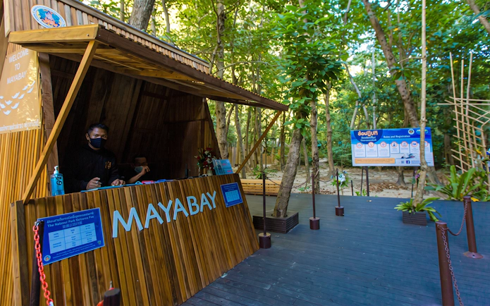 Maya Bay entrance booth surrounded by trees on Phi Phi Island, Thailand.