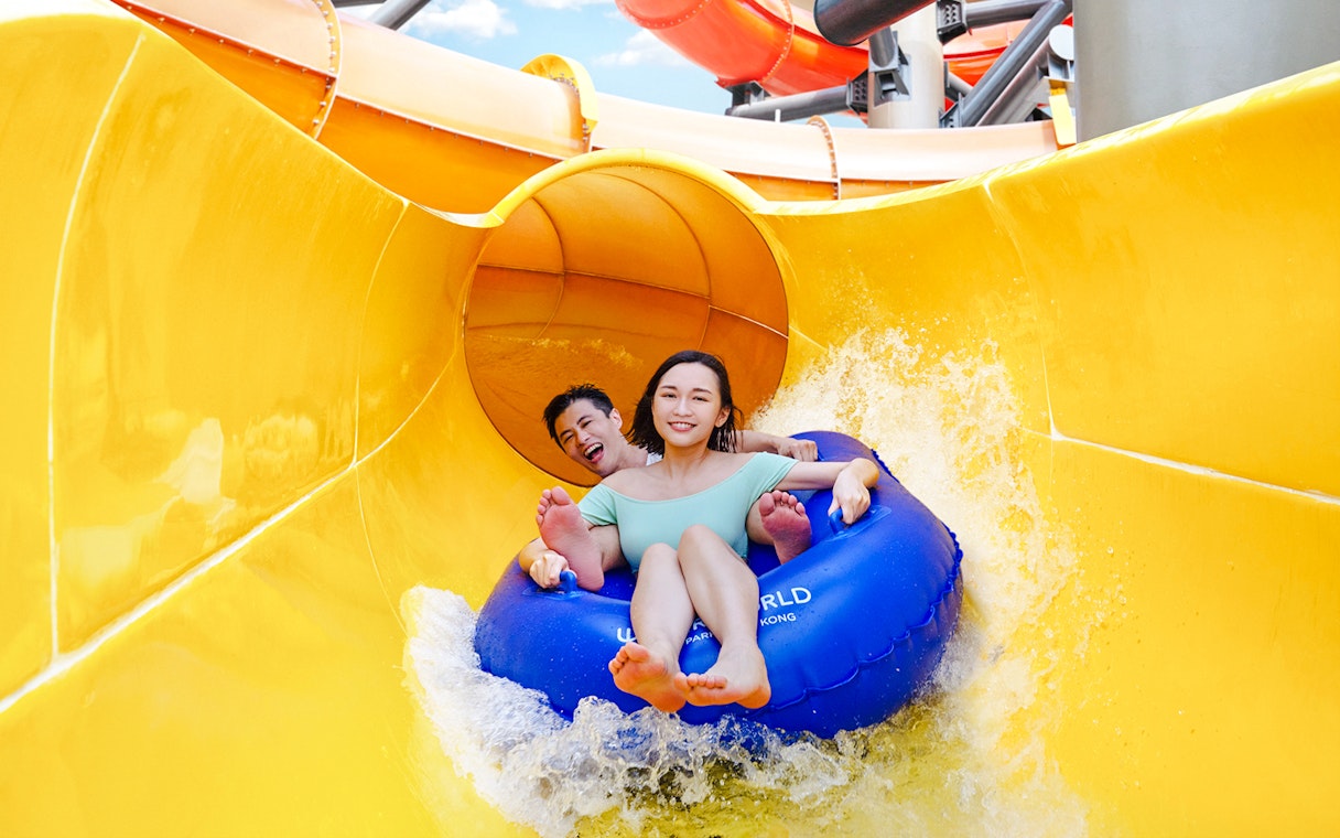 Couple on a water slide at Ocean Park Hong Kong.