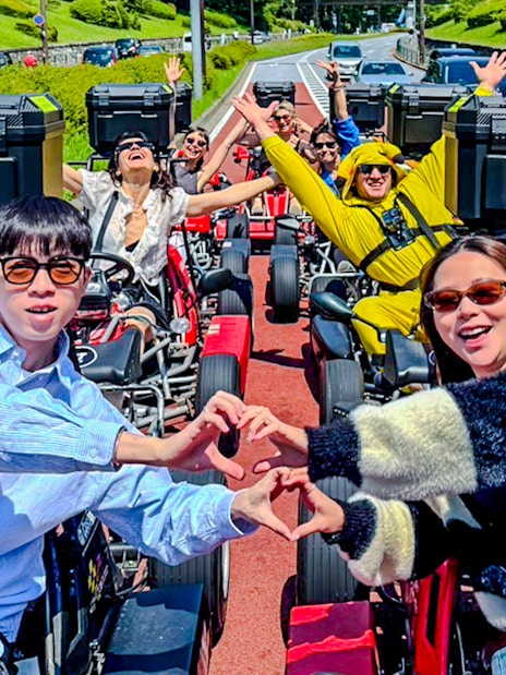 Tourists enjoying a street go-kart experience in Shibuya, Japan.