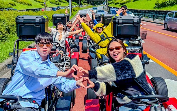 Tourists enjoying a street go-kart experience in Shibuya, Japan.