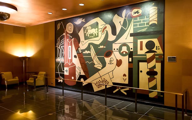 Art deco mural inside Radio City Music Hall during guided tour.