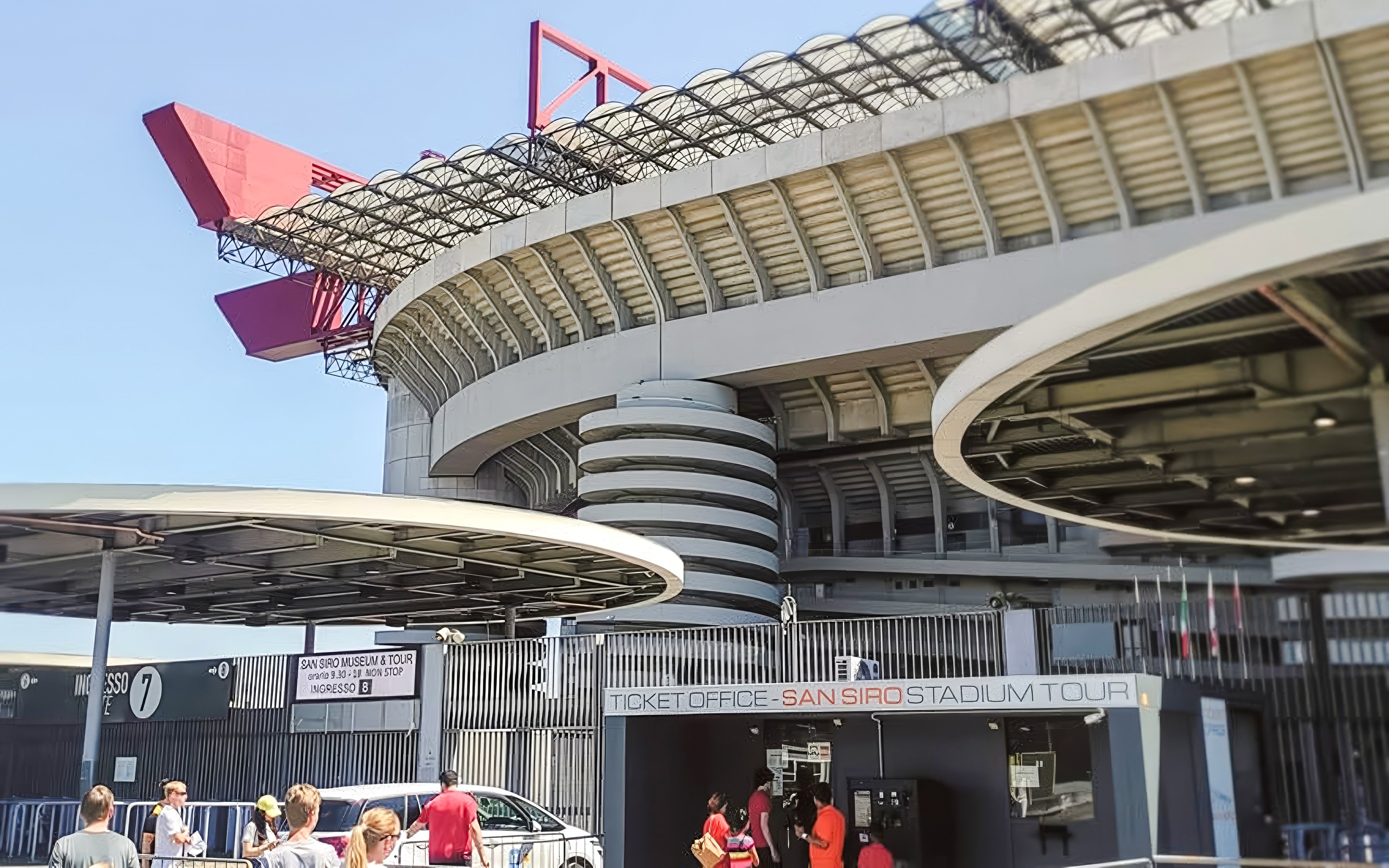 San Siro stadium exterior with ticket office and visitors in Milan, Italy.