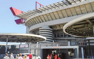 San Siro stadium exterior with ticket office and visitors in Milan, Italy.