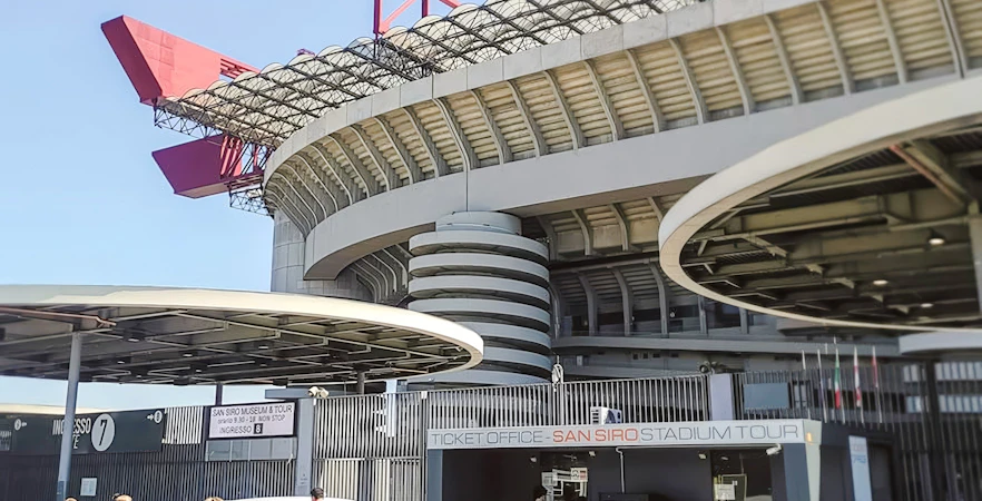 San Siro stadium exterior with ticket office and visitors in Milan, Italy.