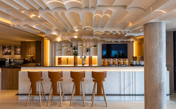 Plaza Premium Lounge bar area with modern decor and seating.