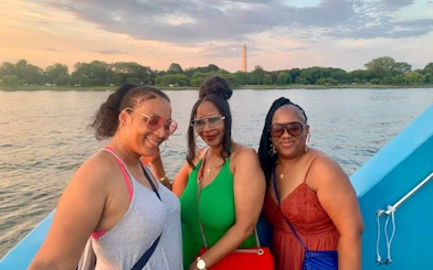 Sightseeing cruise on the Potomac River with Washington Monument in the background.