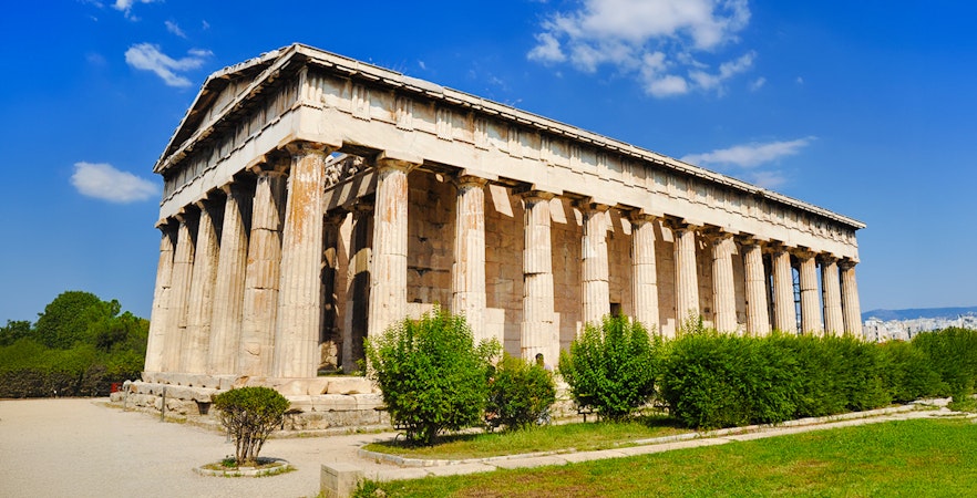 Temple of Hephaestus with columns and greenery, Athens, Greece.