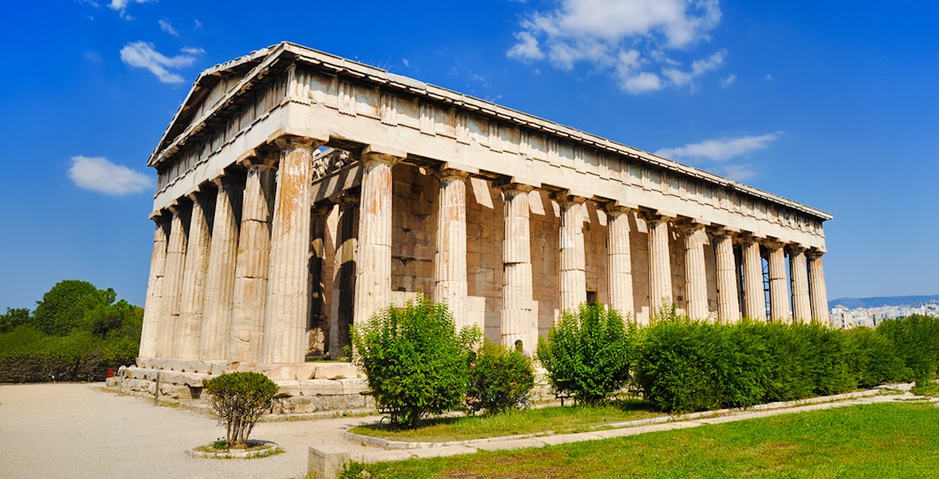 Temple of Hephaestus with columns and greenery, Athens, Greece.