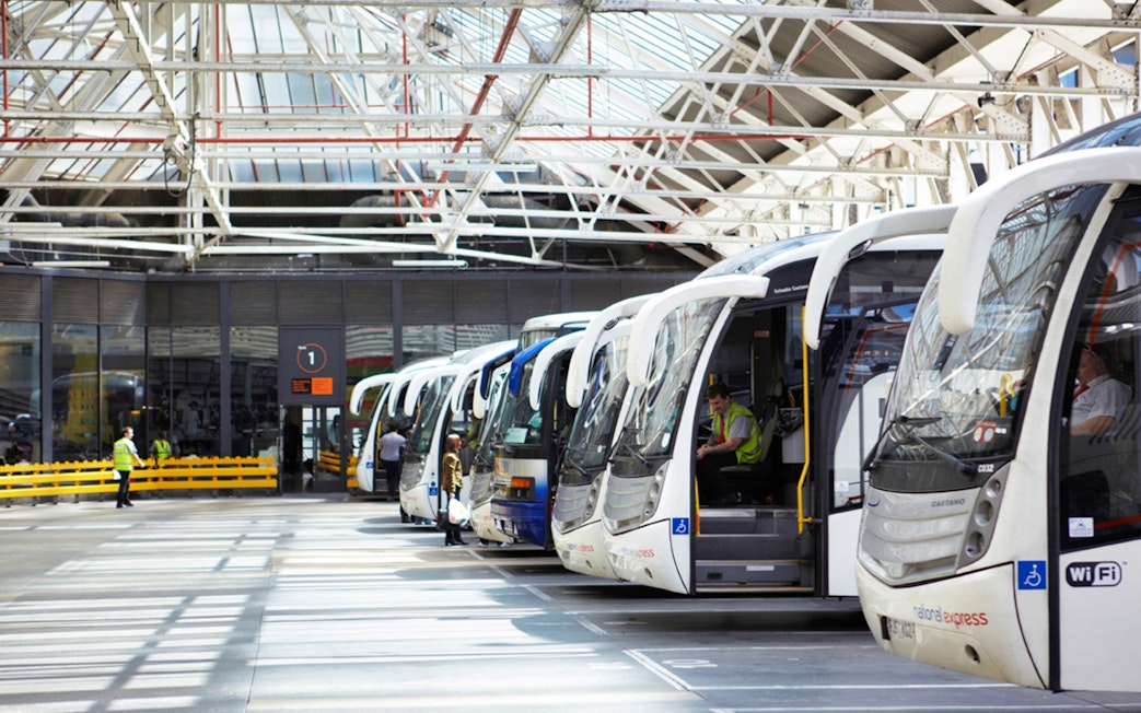 Coaches lined up at a station, ready for one-way trips from Heathrow Airport to London Victoria.
