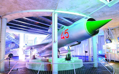 Jet fighter exhibit at Caen Memorial Museum, part of D-Day Landings tour.