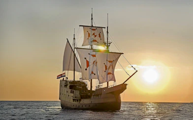 Sunset view of Karaka ship cruise on the sea.