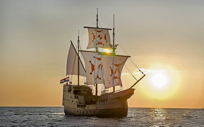 Sunset view of Karaka ship cruise on the sea.