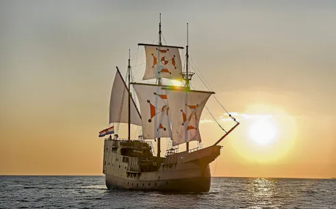 Sunset view of Karaka ship cruise on the sea.