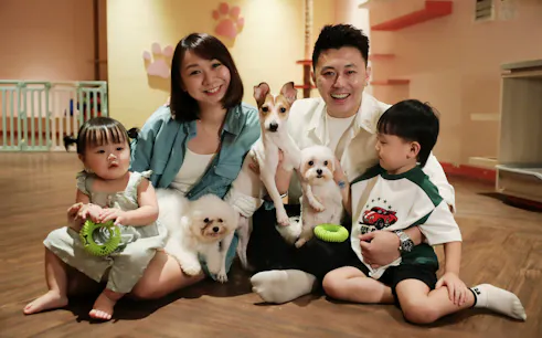 Family with dogs at Just Pets Megastore, enjoying time together.