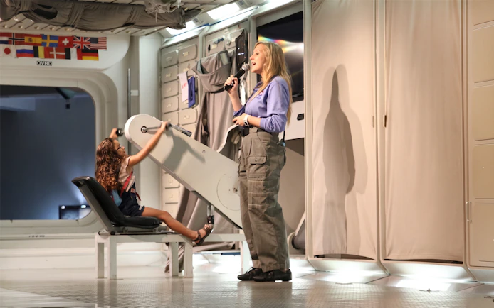 Child using astronaut training equipment at Space Center Houston.