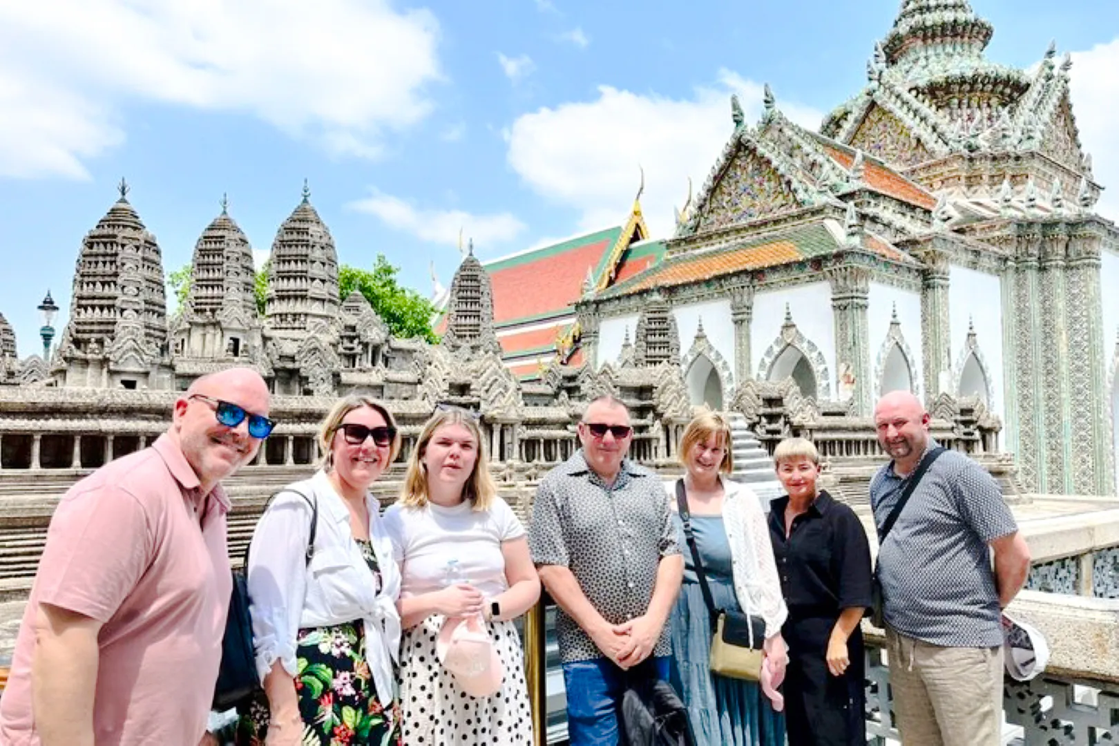 Group of tourists at Wat Phra Kaew, Bangkok, during Grand Palace tour.