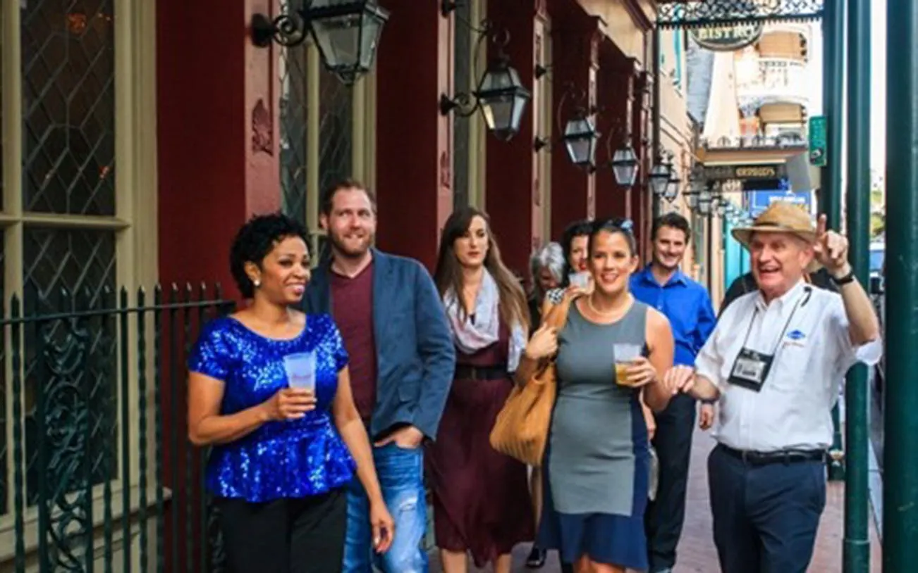Group enjoying a craft cocktail walking tour in New Orleans.