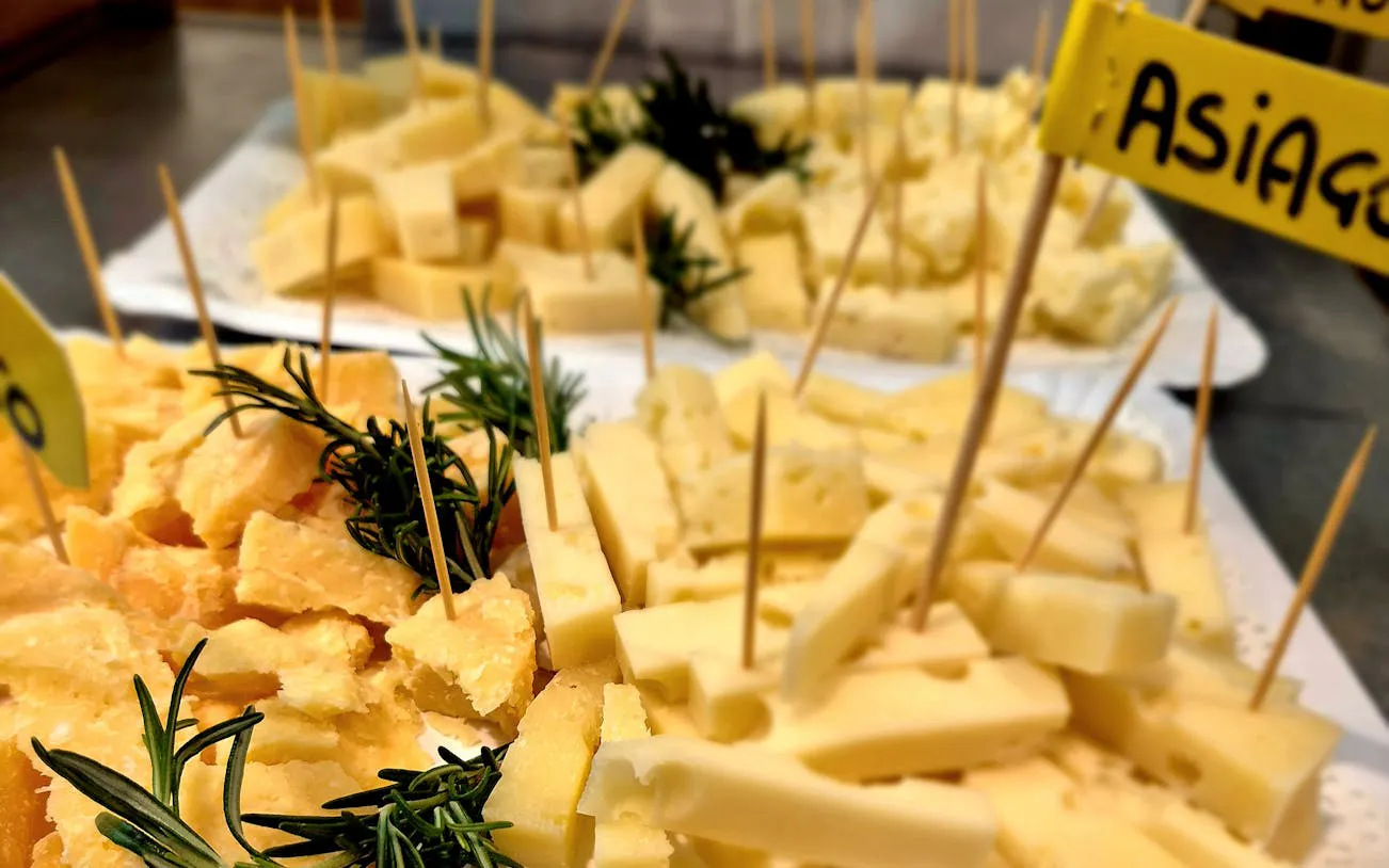 Cheese samples with rosemary at Padova Market food tour.