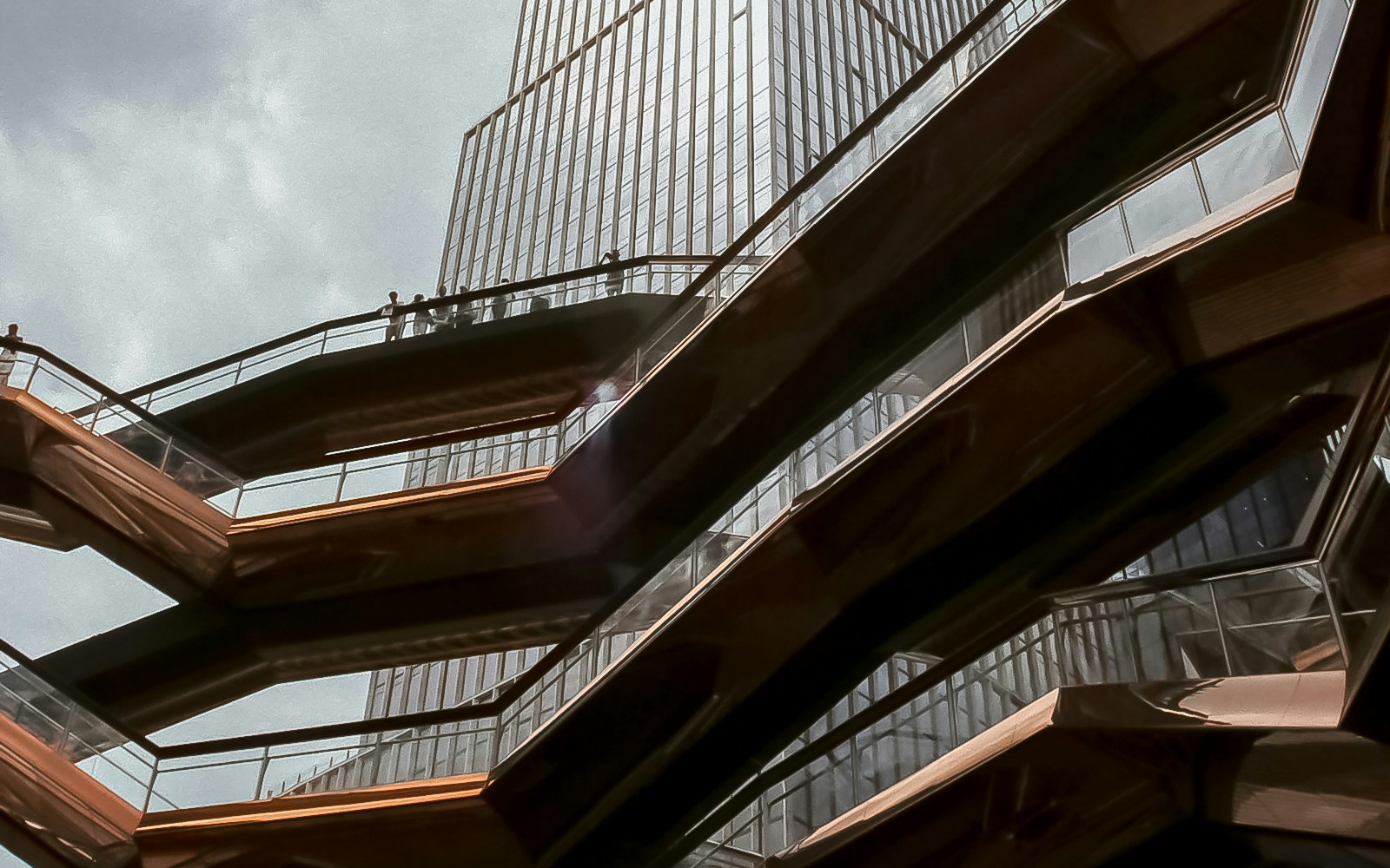 Vessel structure in Hudson Yards, New York City, with people walking on its staircases.