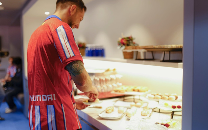 Tourist enjoying lunch buffet at Simeone's Private Box.