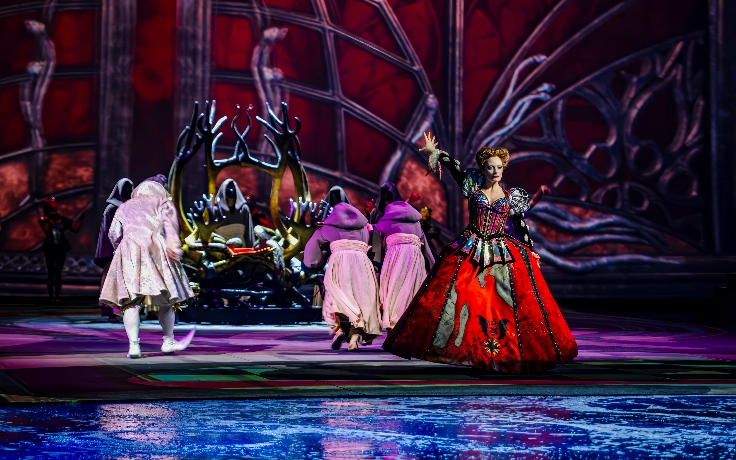 Performers in elaborate costumes during a scene at the House of Dancing Water Show.