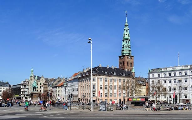 Nyhavn Square with St. Nicholas Church tower, Copenhagen, seen on a Hop-On Hop-Off Bus Tour.